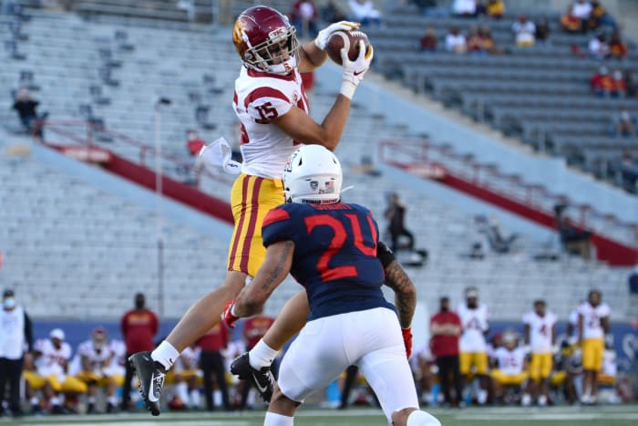 Nov 14, 2020; Tucson, Arizona, USA; USC Trojans wide receiver Drake London (15) makes a catch over Arizona Wildcats defensive back Rhedi Short (24) during the second half at Arizona Stadium. Mandatory Credit: Joe Camporeale-USA TODAY Sports